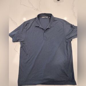 Travis Mathew’s men’s blue polo